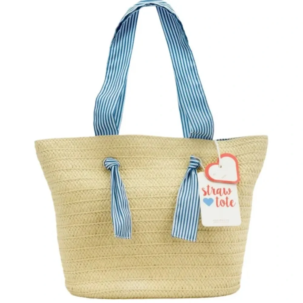 Straw tote bag with striped fabric interior and handles.